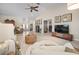 Bright living room featuring light floors, neutral walls, and modern furnishings at 1320 Bayshore Dr, Englewood, FL 34223