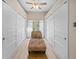 Walk-in closet featuring a chaise lounge and custom storage solutions at 1320 Bayshore Dr, Englewood, FL 34223