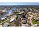 Aerial view of a waterfront property with private boat dock on canal leading to bay and gulf at 1918 Greenlawn Dr, Englewood, FL 34223