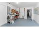 Garage workspace features a workbench with tools and door at 1918 Greenlawn Dr, Englewood, FL 34223