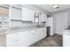 Bright kitchen with modern white cabinets and granite countertops at 1918 Greenlawn Dr, Englewood, FL 34223