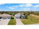 Wide aerial shot of a residential area, showcasing a home with mature landscaping at 194 Sunset Rd, Rotonda West, FL 33947