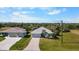 Aerial view of a well-maintained property with lush landscaping and a private setting at 194 Sunset Rd, Rotonda West, FL 33947