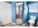 This bathroom features a tiled shower with glass door, a toilet, and a storage closet at 194 Sunset Rd, Rotonda West, FL 33947