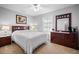 Cozy bedroom with neutral walls, a fan, carpet and a dark wood bedroom set at 194 Sunset Rd, Rotonda West, FL 33947