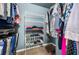 Organized walk-in closet with shelving, hanging racks, and storage solutions at 194 Sunset Rd, Rotonda West, FL 33947