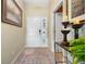 Inviting entryway with tile floors, neutral walls, and decorative accents at 194 Sunset Rd, Rotonda West, FL 33947