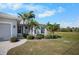 Inviting home with a well-maintained lawn and beautiful curb appeal at 194 Sunset Rd, Rotonda West, FL 33947