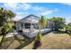 Screened pool and patio area enhance outdoor living with lush tropical landscaping at 194 Sunset Rd, Rotonda West, FL 33947