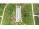 Aerial view of shuffleboard court in the midst of manicured lawns and palm trees at 3220 Southfield Ln # 810, Sarasota, FL 34239