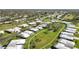 Wide aerial view showcases a neighborhood's well-manicured lawns and mature trees at 3220 Southfield Ln # 810, Sarasota, FL 34239