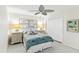 Comfortable bedroom with neutral walls, a ceiling fan, and a closet at 3220 Southfield Ln # 810, Sarasota, FL 34239