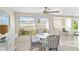 Bright dining area with a glass table and four chairs at 3220 Southfield Ln # 810, Sarasota, FL 34239