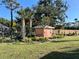 Tranquil backyard showing a shed, landscaping and a privacy fence at 501 Cobalt Rd, Englewood, FL 34223