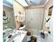 Cozy bathroom with vanity, toilet, tub and shower and well-decorated features at 501 Cobalt Rd, Englewood, FL 34223