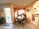 Breakfast nook with tile floors, table with chairs and outdoor access at 501 Cobalt Rd, Englewood, FL 34223