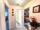 Hallway with bathroom, bedroom, and bonus room access points at 501 Cobalt Rd, Englewood, FL 34223