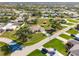 An aerial shot shows property lines of an attractive house with a screened pool at 7424 Snow Dr, Englewood, FL 34224