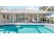 Inviting screened pool with patio seating offers a relaxing outdoor space at 7424 Snow Dr, Englewood, FL 34224