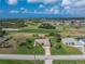 Aerial view of home on the golf course at 934 Rotonda Cir, Rotonda West, FL 33947