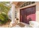 Inviting front entryway with elegant columns and double doors at 934 Rotonda Cir, Rotonda West, FL 33947