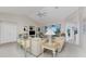 Bright living room featuring vaulted ceilings, built-in shelving, and sliding doors to the lanai at 934 Rotonda Cir, Rotonda West, FL 33947