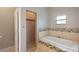 Spa-like bathroom with soaking tub and walk-in shower at 1314 E Knollwood St, Tampa, FL 33604