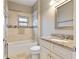 Clean bathroom with granite vanity and a tub shower combo at 1314 E Knollwood St, Tampa, FL 33604