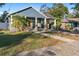 Blue craftsman style home with walkway leading to front door at 1314 E Knollwood St, Tampa, FL 33604