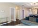 Bright hallway with dark hardwood floors and access to bedrooms at 1314 E Knollwood St, Tampa, FL 33604