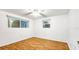 Bright bedroom featuring hardwood floors and ample natural light at 5810 8Th Ave, New Port Richey, FL 34652