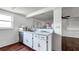 White kitchen with stainless steel dishwasher and sink at 5810 8Th Ave, New Port Richey, FL 34652