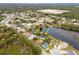 Wide aerial showcasing home's desirable lakefront location at 12321 Smokey Dr, Hudson, FL 34669