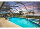 Expansive pool and spa with screened enclosure and sunset view at 12321 Smokey Dr, Hudson, FL 34669