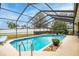 Inviting screened pool area, perfect for relaxation and entertainment at 12321 Smokey Dr, Hudson, FL 34669