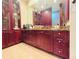 Bathroom with dark wood cabinets and granite top at 1108 Bayhead Ln, Osprey, FL 34229