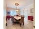 Formal dining room with marble table and six chairs at 1108 Bayhead Ln, Osprey, FL 34229