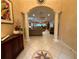 Elegant entryway leading to a living room with high ceilings and tile floors at 1108 Bayhead Ln, Osprey, FL 34229