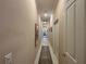 Bright hallway with neutral walls and carpet at 1108 Bayhead Ln, Osprey, FL 34229