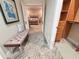 Hallway with bench, closet, and view into bedroom at 1108 Bayhead Ln, Osprey, FL 34229