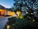 Night view of home exterior with festive landscaping at 1108 Bayhead Ln, Osprey, FL 34229