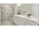 Modern bathroom featuring a double vanity, and glass shower doors at 9039 Duany Ln, Lakewood Ranch, FL 34240