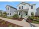 Inviting home showcasing an airy porch, manicured garden and vibrant landscaping at 9039 Duany Ln, Lakewood Ranch, FL 34240