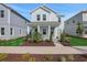 Charming two-story home with a welcoming front porch and landscaped yard at 9039 Duany Ln, Lakewood Ranch, FL 34240