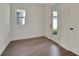 This room features sleek wood floors and a glass door leading to the outdoors at 9039 Duany Ln, Lakewood Ranch, FL 34240