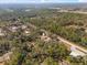 This aerial view showcases property near highways, abundant trees, and commercial establishments at 2044 Culbreath Rd, Brooksville, FL 34601