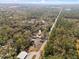 Drone shot of the property showing it is surrounded by trees, and close to a highway at 2044 Culbreath Rd, Brooksville, FL 34601