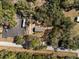 This aerial view shows the property is surrounded by dense woods at 2044 Culbreath Rd, Brooksville, FL 34601