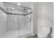 Bathroom showcasing a glass-enclosed shower with white tile and modern fixtures at 2044 Culbreath Rd, Brooksville, FL 34601
