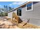 Side view of the house exterior showing siding, deck and window at 2044 Culbreath Rd, Brooksville, FL 34601